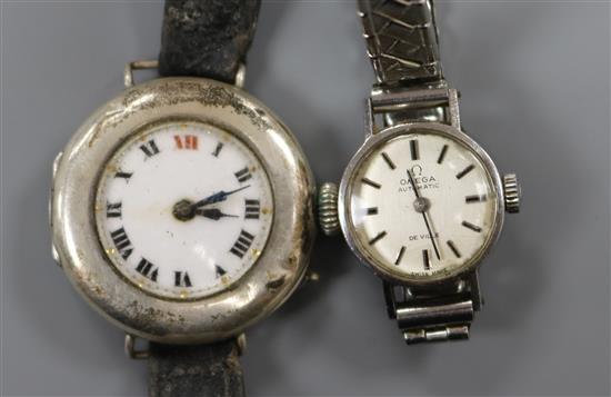 A ladys stainless steel Omega De Ville automatic wrist watch and an early 20th century silver wrist watch.
